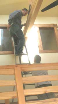 Installing track light on the high beam of the Great Room